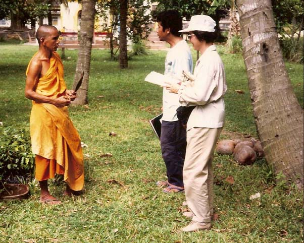 Professor Nukul Ruttanadakul and Dr. Poranee Natadecha-Sponsel interviewing monk in Southern Thailand.